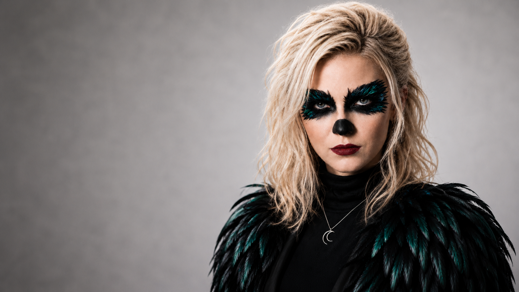 Clarapetra musician and recording artist official portrait with feathered black wings